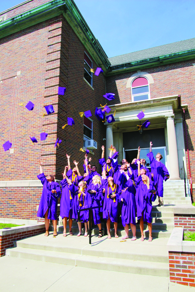 Members of the Rivet High School Class of 2019 toss the
caps in the air after the May 18 Commencement
Ceremony at the high school.