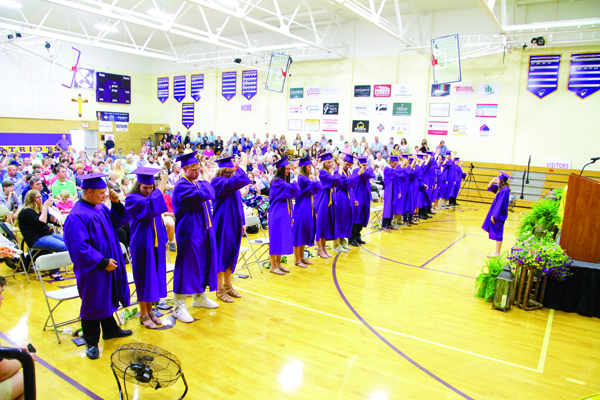 Class of 2019 President Savannah Cook leads her Rivet High School classmates as they move
their tassels to signify their status as graduates.