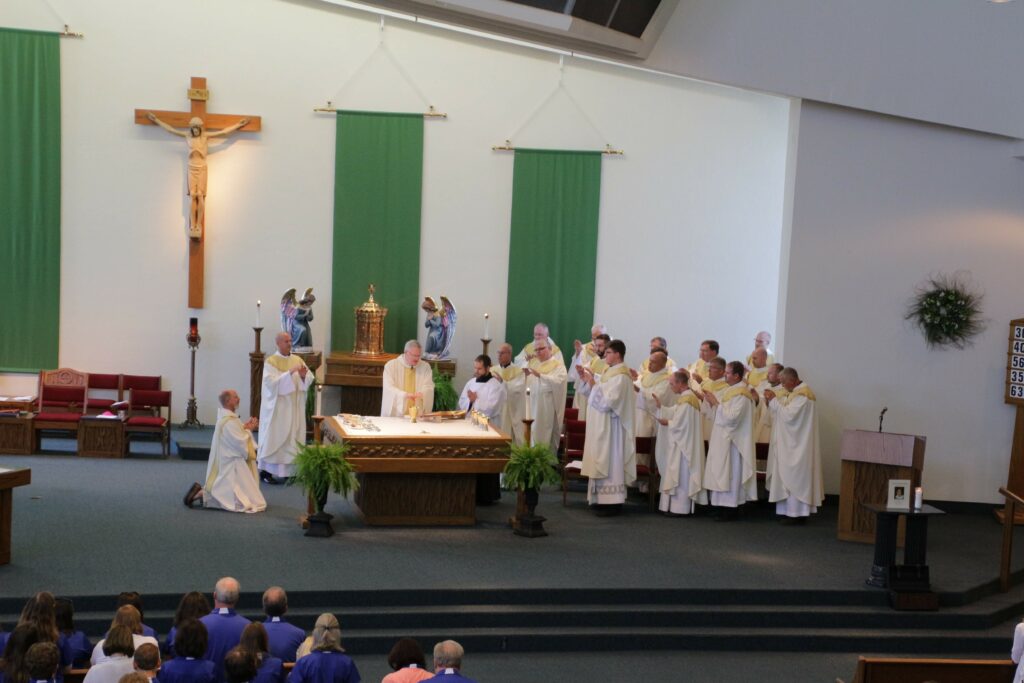 Bishop Joseph M. Siegel prays the Eucharistic Prayer during the annual Back-to-School Mass on Aug. 2, 19 priests of the diocese concelebrated Mass with the bishop and Deacon Joe Siewers assisted.