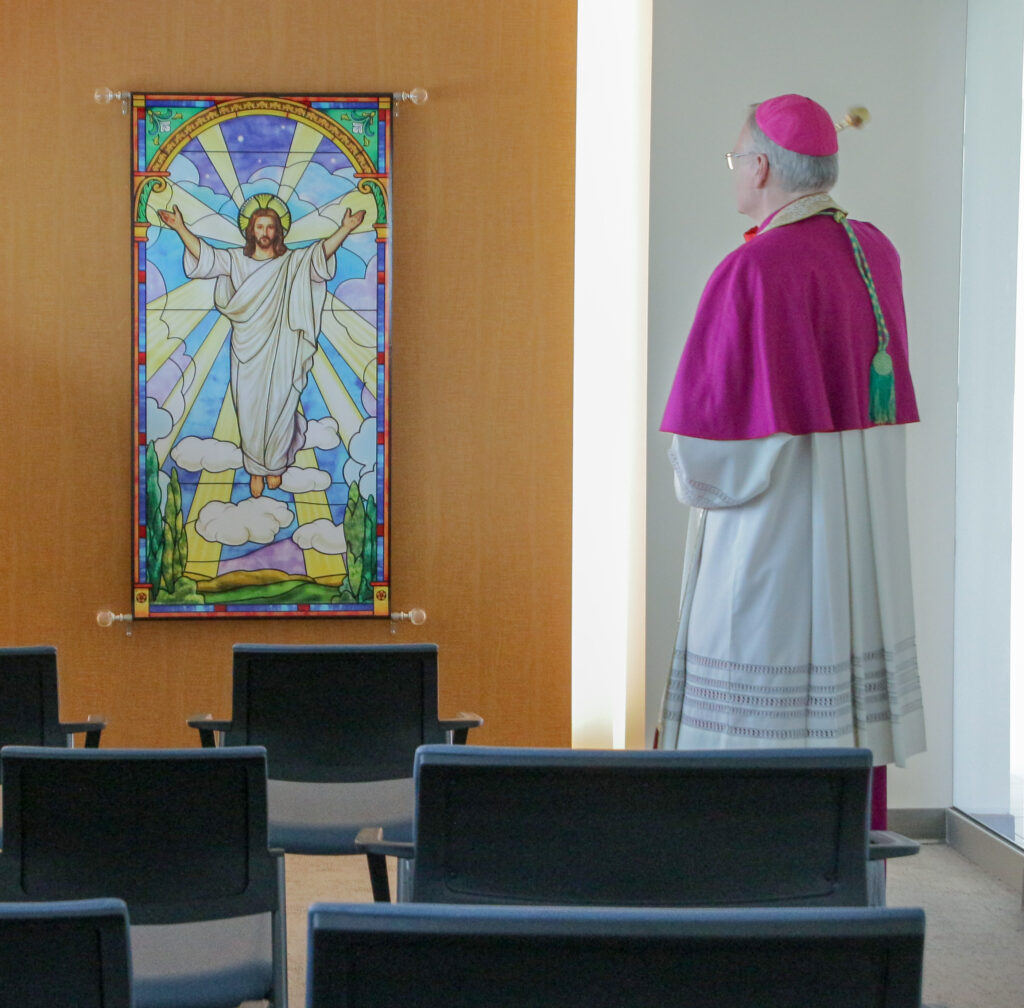 Bishop Siegel sprinkles holy water in the hospital’s Ascension of Our Lord Chapel.