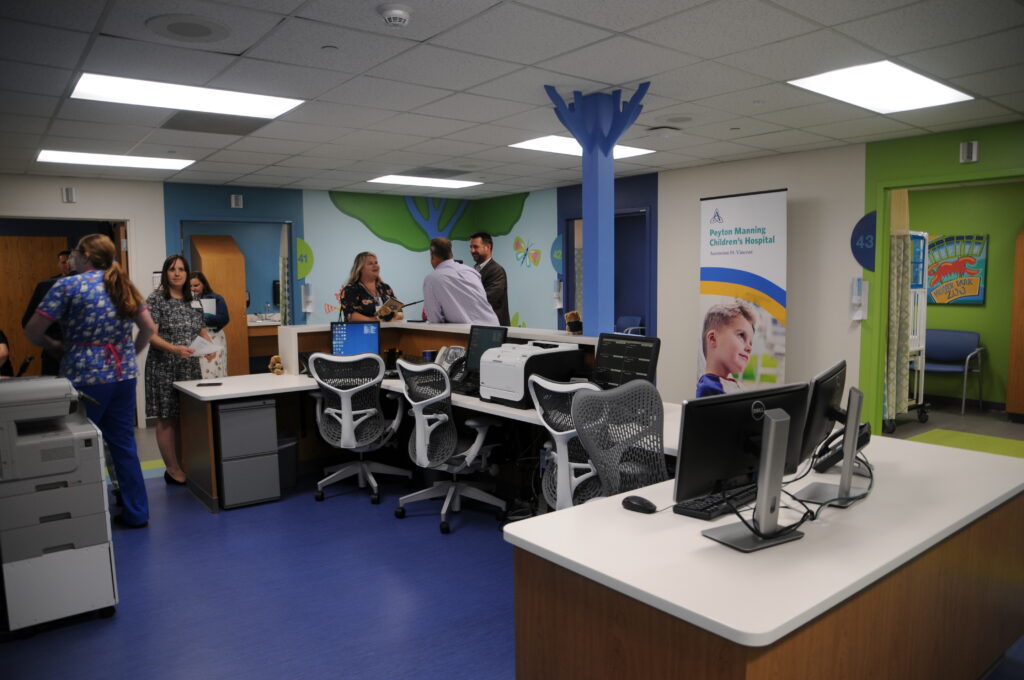 The nurse station of the new Peyton Manning Children’s Hospital Emergency Room for Children at St. Vincent Evansville, with doors to the seven private treatment rooms surrounding it.