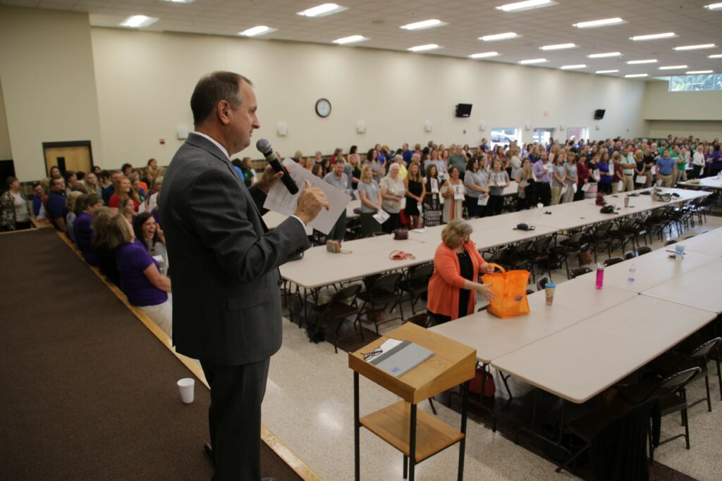 Dr. Daryl Hagan, diocesan superintendent of schools, explained rules of an ice-breaker game that Catholic educators played at the Aug. 2 back-to-school gathering.