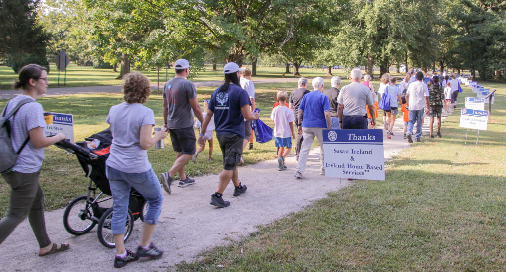 As they set out on the 12 th Annual Friends of the Poor Walk, the large group of walkers passed by
dozens of signs thanking sponsors. Some have supported the event since the very beginning. The Message photo by Tim Lilley