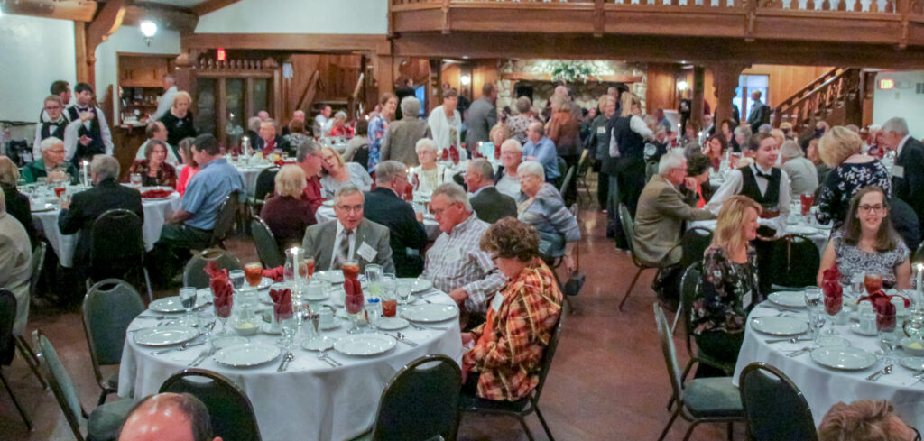 A large crowd mingles during the annual gathering of St. Meinrad alumni and friends, held Oct. 15 at the Bauerhaus in Darmstadt, on Evansville’s far north side. The Message photo by Tim Lilley