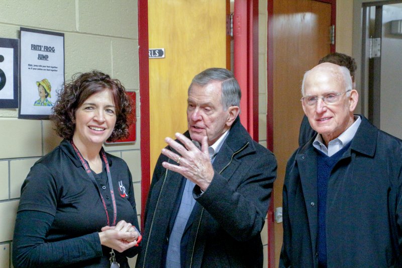 Jim Meuhlbauer, center, vice-chairman of Evansville’s Koch Enterprises, Inc., asks Holy Redeemer School principal Andrea Dickel a question as he and Koch Enterprises, Inc. Chairman Bob Koch tour the school on Jan. 30. The Koch Foundation awarded a grant to Holy Redeemer to support Leader in Me training for the school’s students and teachers. The Message photo by Tim Lilley
