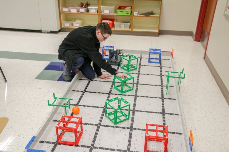 Holy Redeemer student seventh-grader Rylan Garrett demonstrates a robotics project during the Come and See event. The Message photos by Tim Lilley