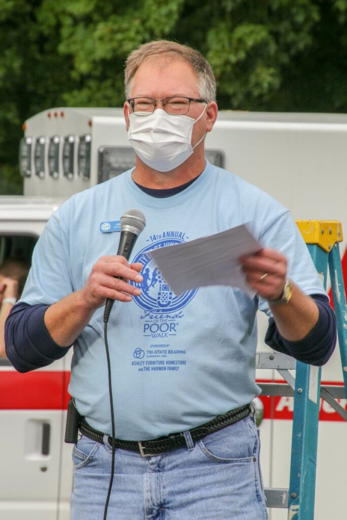 Joe Cook, executive director of the Evansville district of St. Vincent de Paul, tells the crowd that the event raised $27,000 through sponsorship this year, well above the goal of $25,000. The Message photo by Tim Lilley