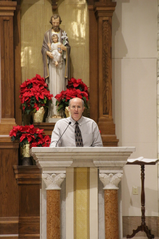 Ed Walker of St. Mary Parish in Sullivan served as lector for the Mass. The Message photo by Tim Lilley