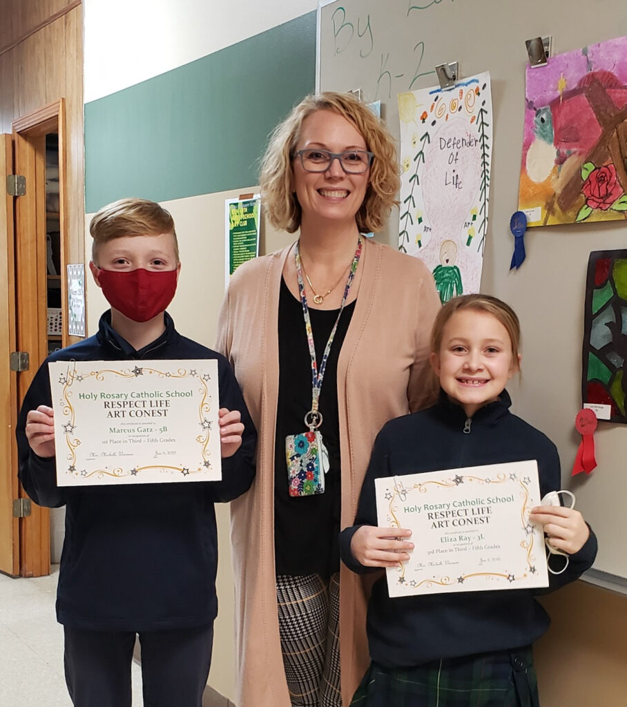 Third-Fifth grade winners. Pictured are Marcus, left, Mrs. Weisman
and Eliza; John, not pictured.