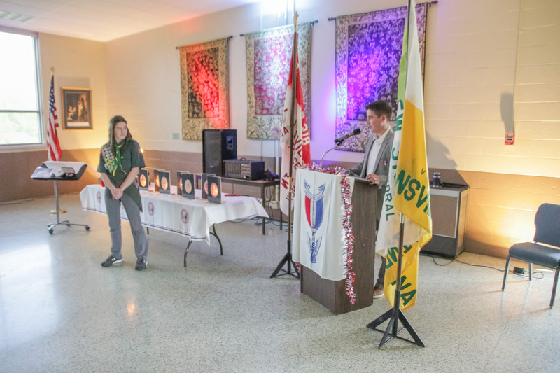 Daniel Payne, right, speaks to his sister Nicole about her achievement as a new Eagle Scout. For his Eagle Scout project, Daniel restored the nine-foot crucifix over the altar of St. Benedict Cathedral in Evansville and the six-foot statue of Jesus that stands atop the cathedral’s Baldacchino. He also built nine shadow boxes that were installed in the cathedral during its 2019 renovation. The Message photo by Tim Lilley