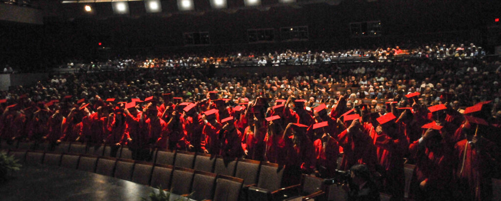 Mater Dei’s Class of 2022, which included 120 graduates, move their
tassels to signify their status as high school graduates during the May 22 commencement
ceremony. The Message photo by Megan Erbacher