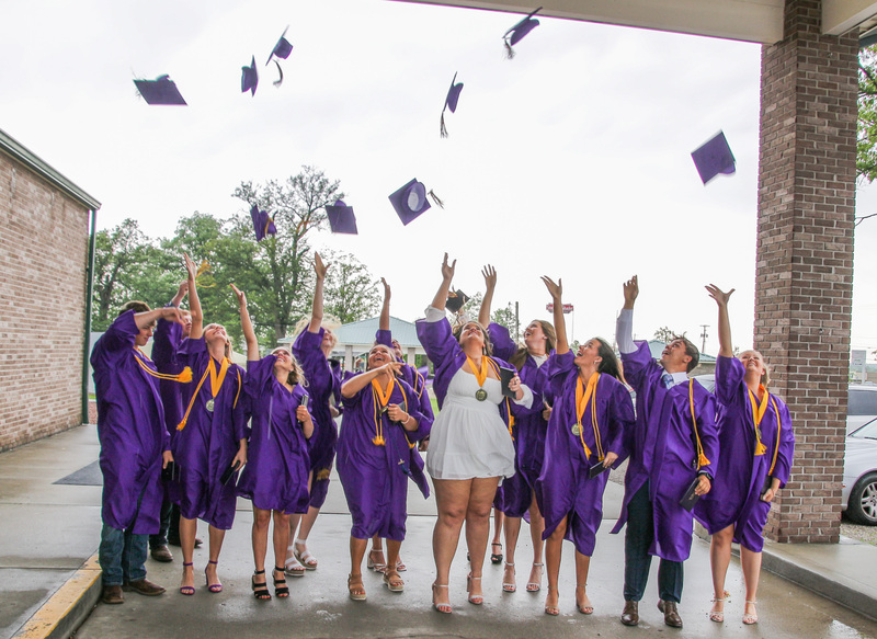 The Rivet class of 2022 celebrates commencement with a group cap toss following the May
21 ceremony at the school. The Message photo by Tim Lilley