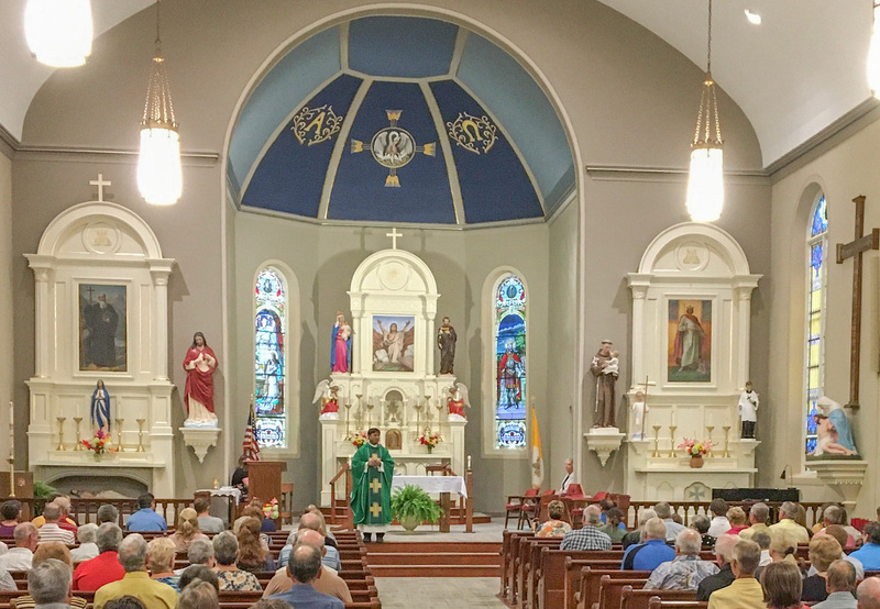 Father Anthony Govind, administrator of Christ the King Parish, welcomes everyone to the 7:30 a.m. Mass July 31 in St. Henry Church, St. Henry. Submitted photo