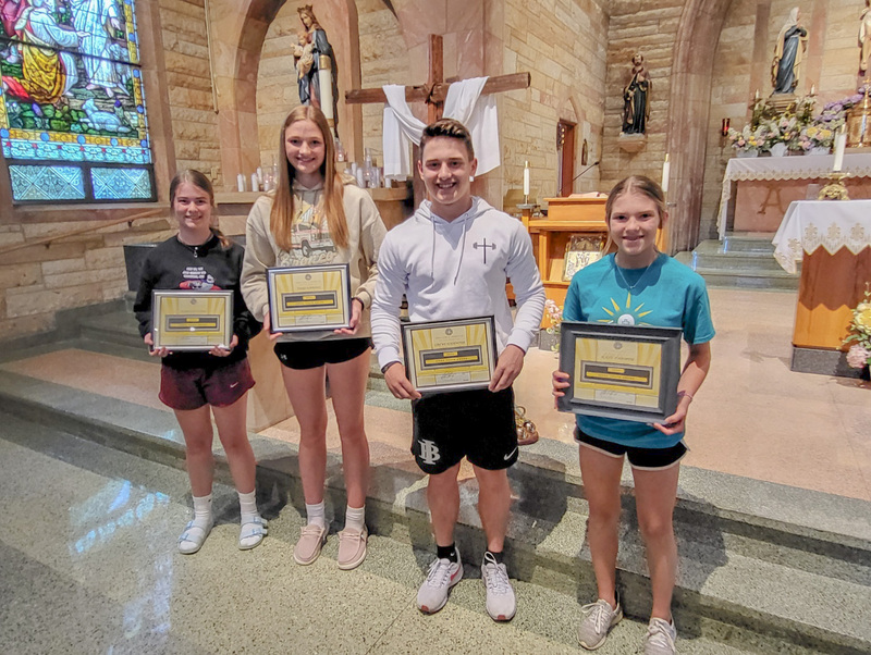Youth Service Award honorees from Sts. Peter and Paul School in Haubstadt and Holy Cross School in Fort Branch are Meredith Mann, left and Paige Schnaus from Holy Cross, and Crewe Hasenour and Kate Parmer from Sts. Peter & Paul. Submitted photo