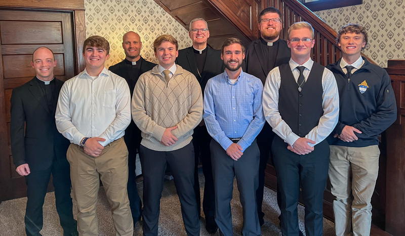 Father Tyler Tenbarge, left, Eliott Church, Father Christopher Droste, Landon Wagner, Bishop Joseph M. Siegel, Nick Freberger, Father Luke Hassler, Jack Martin and Nick Folz pause for a photo in the foyer of the Father Deydier House at Sacred Heart Church in Evansville. Bishop Siegel joined Program Director Father Tyler; Program Spiritual Director Father Luke; and St. Boniface Parish Pastor Father Christopher, who now lives in residence at the Father Deydier House.
Photo by Ed Kuhn, special to The Message